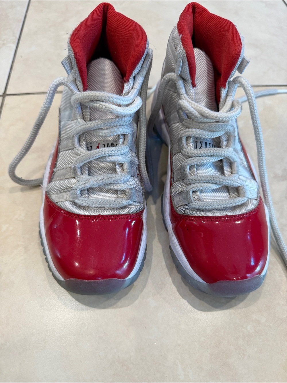 Air Jordan 11 Retro cherry color Kids red and white sneakers - size 3.5